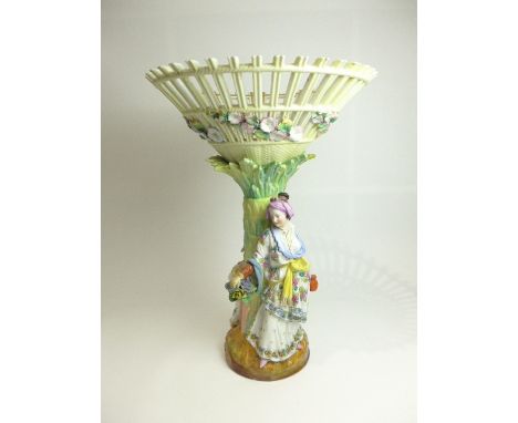 A Marcolini Meissen porcelain figural table centrepiece with a conical basket supported by a palm tree trunk, moulded with a 