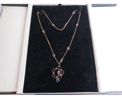 An Edwardian amethyst and seed pearl pendant, stamped 9ct hung on a gold chain with amethyst spacers, 42cm long, 6g total