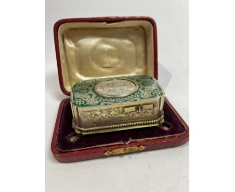 A fine Victorian John Manger silver singing bird box. The top decorated with green enamel, the sides with engraved dianthus p
