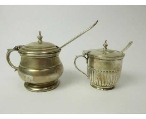 Two mustard pots including Hicklenton &amp; Sydal, Birmingham 1934, with blue glass liner and Stokes &amp; Ireland example wi