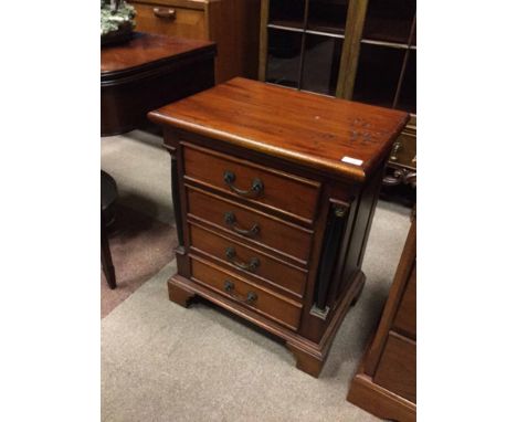 LATE 20TH CENTURY MAHOGANY INDONESIAN BEDSIDE CHEST
with four drawers flanked by inset column pilasters, on bracket feet, 55c