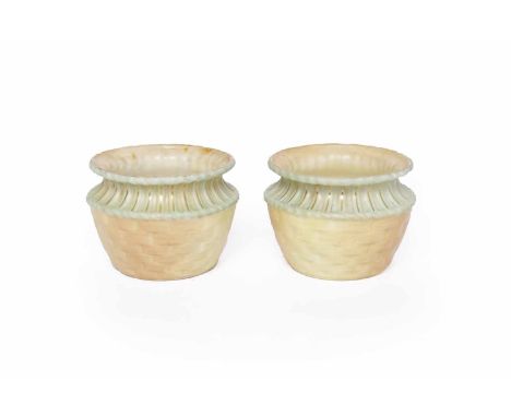 PAIR OF LATE VICTORIAN ROYAL WORCESTER FERN POTS
each of squat baluster form and of basket weave design, the rim in green wit