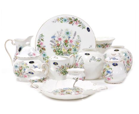 A group of Aynsley porcelain Wild Tudor pattern ornaments, including a watering can, a preserve jar, rose bowl, covered caddy