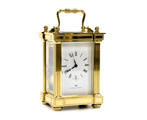 A Matthew Norman brass cased carriage clock, rectangular dial bearing Roman numerals, twin barrel movement, with coil strike,