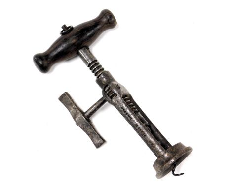 A 19thC Lunds Patent London rack corkscrew, 17cm high.