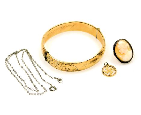 A pendant with a Hindu symbol, stamped 9, 0.6g, a neck chain, gold plated bangle, with foliate engraving, banner reserve engr