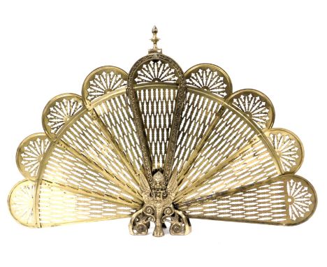 A brass fan fold fire screen, raised on griffin monopodia and scroll feet, 63cm high.