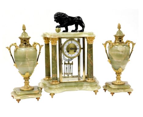 A late 19thC French green onyx and brass clock garniture, circular brass dial with enamel chapter ring bearing Roman numerals