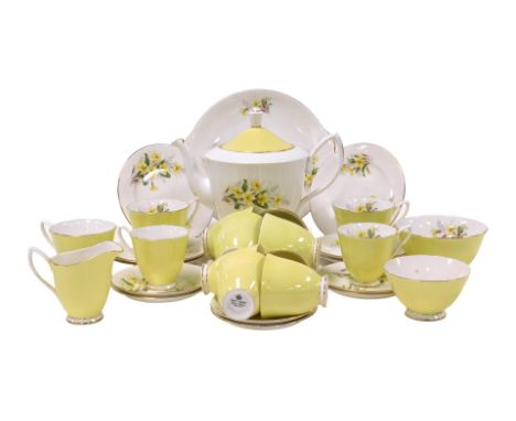 A Royal Albert Yellow Primrose pattern porcelain part tea and coffee service, comprising teapot, cream jug, pair of graduated