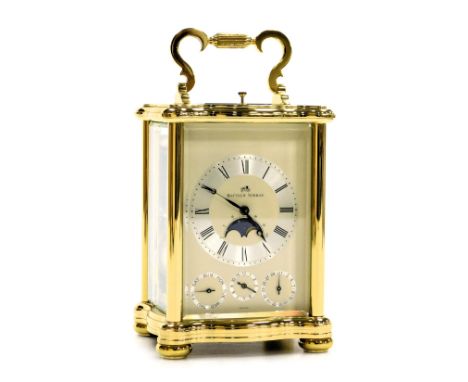 A Matthew Norman brass carriage clock, rectangular dial with chapter ring bearing Roman numerals, day, alarm and date dials, 