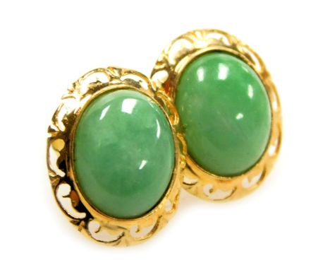 A pair of cabochon jade earrings, set in yellow metal, stamped 14k, 2.1g.