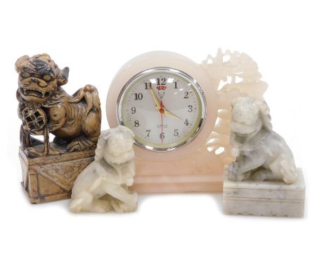 A Chinese pink soapstone cased mantel clock, circular dial bearing Arabic numerals, date aperture, centre seconds, clockwork 
