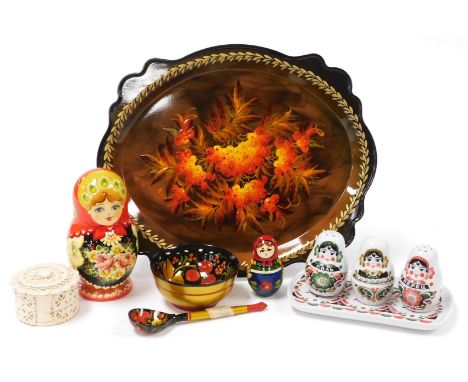 A Russian lacquer tray, painted with fruits, 28cm high, two Matryoshka dolls, a lacquer bowl and spoon, carved circular box, 