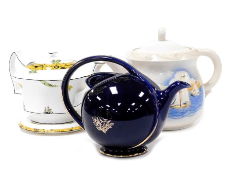 An early 20thC Melbaware Dolly Varden porcelain teapot, cover and stand, an American Hall blue six cup teapot, gilt decorated