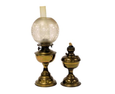 An early 20thC brass oil lamp, with chimney and etched glass shade, 54.5cm high, and a brass oil lamp base. (2)