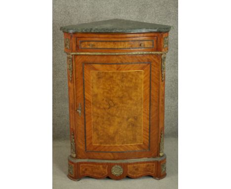 A reproduction French Louis XV style corner cabinet, the green marble top with a moulded edge over a single drawer above a cu