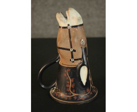 A Greek, late archaic period style painted ceramic handled drinking cup in the form of a bridled mules head. H.20 Dia.14cm. 
