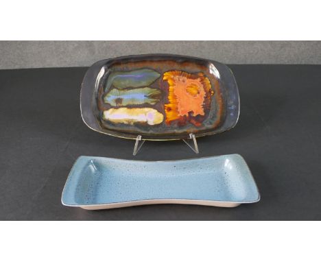 An Eric Leaper Newlyn studio pottery abstract design platter along with a Poole pottery blue glaze bowtie plate. Signed Leape