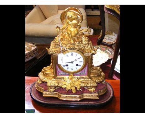 A French ormolu and porcelain mantel clock with striking bell movement, the enamel dial marked Crohe - 24 Wigmore Street, Lon