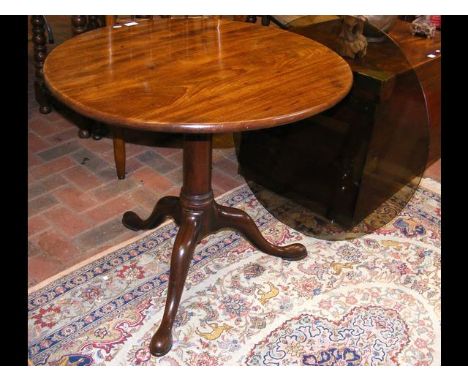 A Georgian mahogany snap-top tripod table - 76cm diameter 