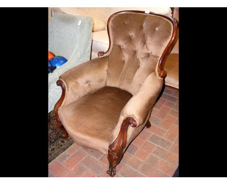 A Victorian button back easy chair 