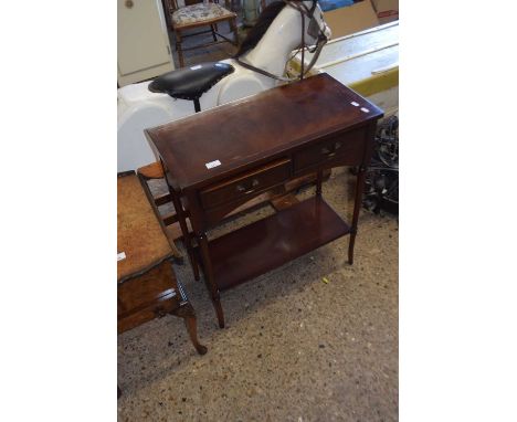 A reproduction mahogany two drawer side table with base shelf and tapering legs