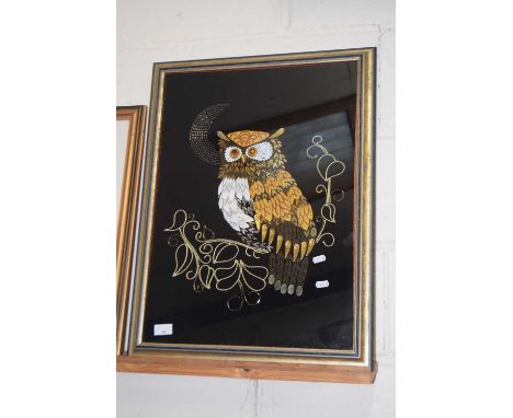 A framed collage tapestry of an owl