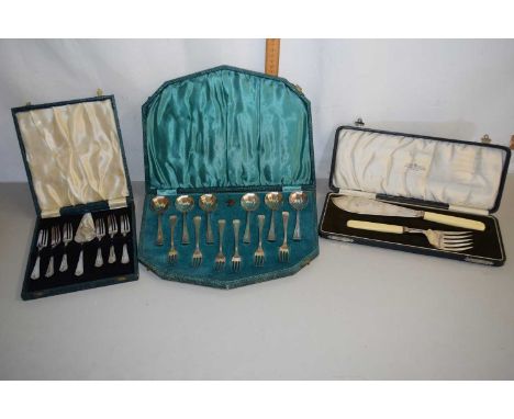 A cased pair of fish servers with ivorine handles, cased silver plated spoon and fork set and further cased plated cake forks