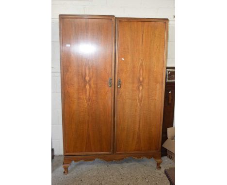 An early 20th Century walnut veneered double door wardrobe by Maple &amp; Co with fitted interior