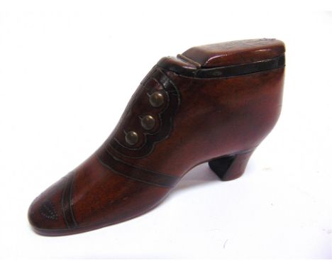 A VICTORIAN TREEN SNUFF SHOE  with inlaid brass pin decoration, the heel dated '1877', 10.5cm long. Condition Report : Genera