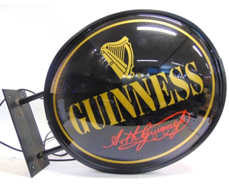 BREWERIANA - A GUINNESS ILLUMINATED WALL SIGN  of double-sided right-angle type, complete with mounting bracket, 68cm wide. C