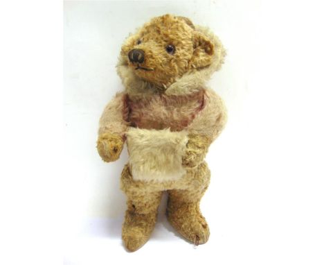 A PALE GOLD MOHAIR TEDDY BEAR  circa 1930s, possibly by Chad Valley, wearing a smoking-style hat and an integrally fashioned 