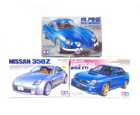 THREE 1/24 SCALE UNMADE MODEL SPORTS CAR KITS  comprising a Tamiya No.24231, Subaru Impreza WRX Sti; Tamiya No.24246, Nissan 