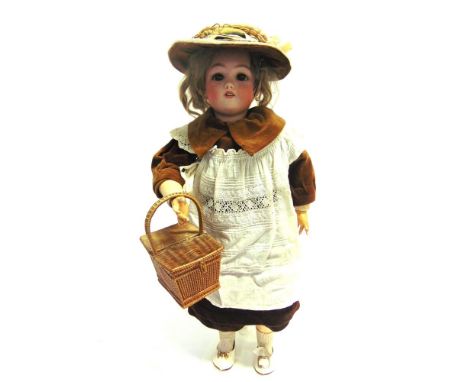 A SIMON &amp; HALBIG FOR CUNO &amp; OTTO DRESSEL BISQUE SOCKET HEAD DOLL  with a light brown wig, sleeping brown glass eyes, 