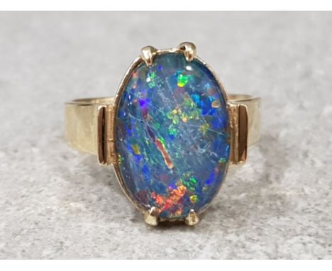 Ladies 9ct yellow gold blue opal ring, comprising of a oval shaped blue opal set in a claw setting, 4.4g gross, size N