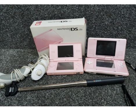 Two Nintendo DS portable games consoles (1 is DS lite) together with Nintendo Wii controllers and xshot selfie stick