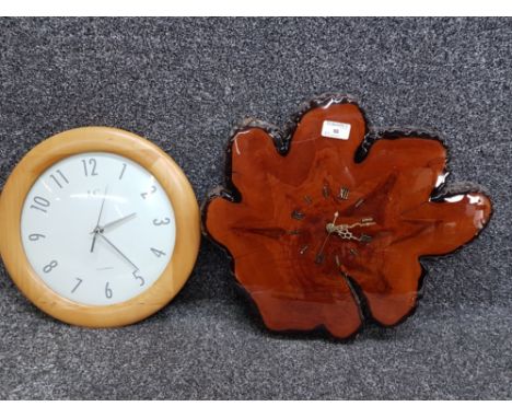 Two modern wall clocks, one made out of a section of tree trunk 43cm wide.