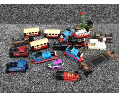 Job lot of minature train engines and carriages, Thomas the tank engine etc also includes train keyrings
