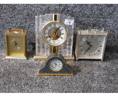 Three modern mantle clocks and a brass carriage clock.