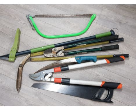 Garden tools to include saw and loppers.