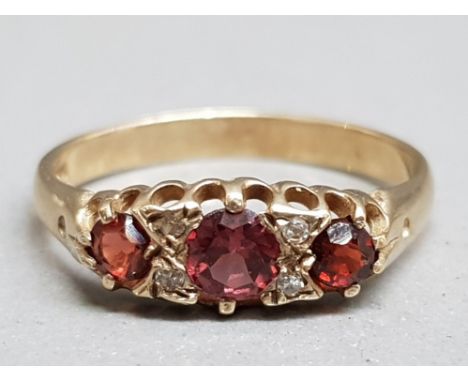 A 9ct yellow gold pink stone and diamond ring size O 1.84g.