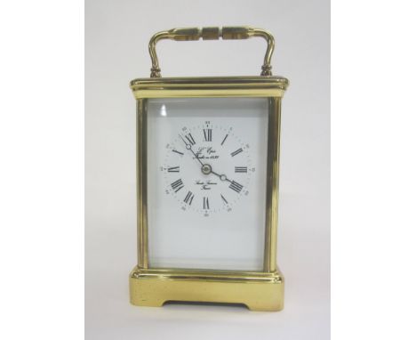2 Train Lacquered Brass Carriage Clock by L'Epe with white enamelled dial, Roman numerals, Arabic outer seconds, half hour st
