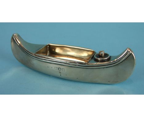 A novelty table lighter/ashtray by Stokes & Ireland Ltd in the form of a canoe, 13cm long, London 1904, ___2.3oz.