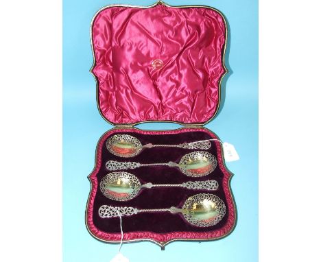 A set of four Victorian silver gilt fruit spoons by Harrison Bros & Howson, each with pierced foliate terminal and bowl joine