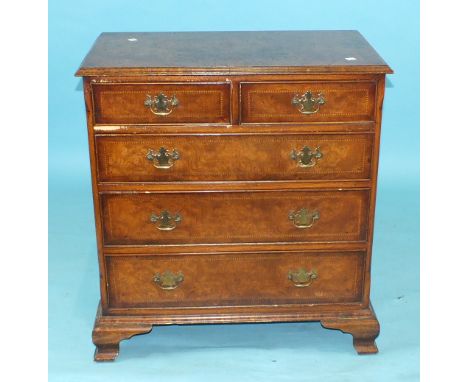 A Georgian-style chevron-banded walnut chest, the rectangular top with moulded edge above two short and three long cockbeaded