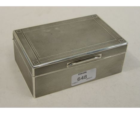 An engine-turned cigarette box of rectangular shape, with chevron border, by William Comyns & Sons Ltd, 14cm wide, London 193