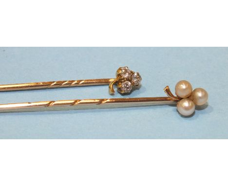 A Victorian gold stick pin set a trefoil of old brilliant cut diamonds, cased and a similar stickpin set pearls, 2.7g, (2).