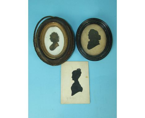 A 19th century oval gilt and black miniature portrait of a lady, 9 x 5cm and two other miniatures, (3).