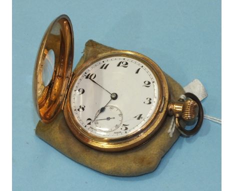 A gold-plated half hunter keyless pocket watch, the outer chapter ring with Roman numerals, the white enamel dial (cracked) w