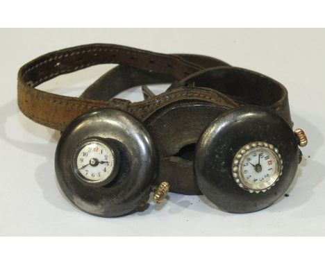 A pair of Edwardian "his and hers"  buttonhole watches, both with white enamel dials with Roman numerals and gun metal cases,